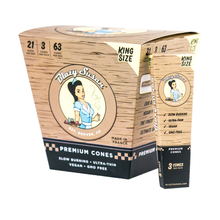 Blazy Susan Unbleached Paper Cones are available in packs or individual boxes with a retro woman logo. The packaging highlights that they are vegan, slow-burning, ultra-thin, and GMO-free King Size pre-rolled cones.