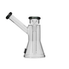 The Tyson Upper Cut Bubbler features clear borosilicate glass, a beaker-shaped base, side mouthpiece, and black accents on the mouthpiece and bowl. Its simple, functional design showcases an internal downstem inspired by the Tyson 2.0 Uppercut line.