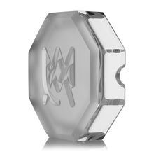 The MJ Arsenal Pegasus Ashtray features a clear, octagonal crystal design with beveled edges and an engraved M on the front, showcasing luxury style reminiscent of fine paperweights, displayed against a white background.