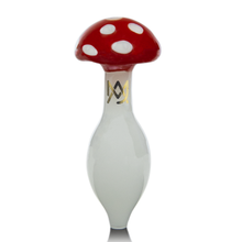 The MJ Arsenal Carb Cap features a red and white spotted mushroom design with a smooth white stem and gold logo. This unique spinner carb cap enhances directional airflow, shown here against a plain white background.
