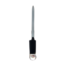 The MJ Arsenal Excalibur Dab Tool features a thin, pointed metal blade and a black handle topped with a clear borosilicate glass circular end displaying an inner decorative element, all set against a white background.