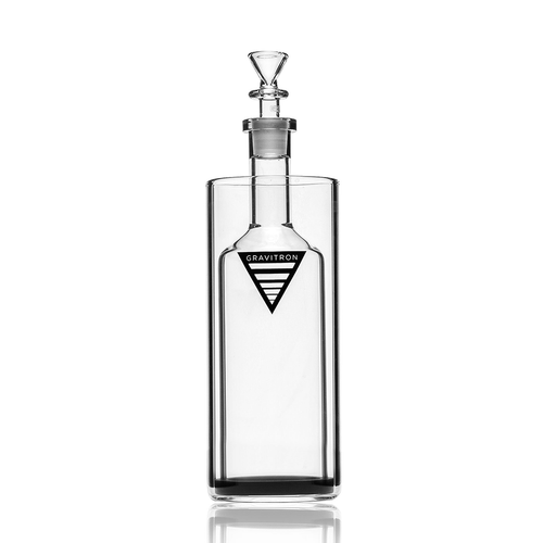 The Grav Gravitron is a clear glass bottle with a stopper and a black and white triangular logo on the front, shown against a white background.