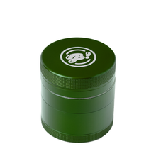 The BIGFUN! Small Grinder is a green aluminum grinder with a textured grip and a white circular stylized "B!" logo on the lid. It features a built-in pollen sift compartment, all shown on a plain white background.