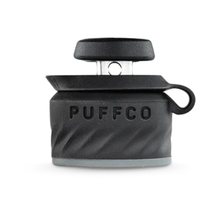 The Puffco Peak Pro Joystick Cap, a black and gray accessory with swirl texture, Puffco logo, silicone loop, and metal handle for directional airflow, is displayed against a white background.