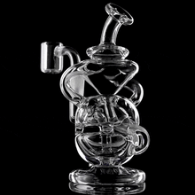 The MJ Arsenal Infinity Mini Dab Rig, made of clear borosilicate glass with multiple chambers, curved tubes, and a fab egg percolator, spins against a black background.