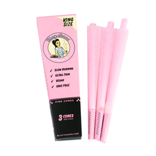 A pink pack labeled Blazy Susan Pink Paper Cones (King Size) with three pink pre-rolled cones beside it. The packaging highlights slow burning, ultra-thin, vegan, and GMO free—perfect for premium king size cones.
