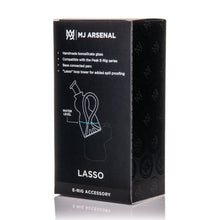 A black box displays white text and graphics for the MJ Arsenal Lasso Puffco Peak Top, showing branding, product details, and a diagram highlighting its borosilicate glass Puffco Peak attachment on the packaging.