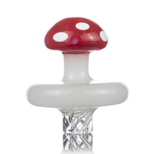 The MJ Arsenal Carb Cap features a mushroom design with a red cap and white spots, white stem, and a clear twisted glass base for directional airflow, displayed against a white background.