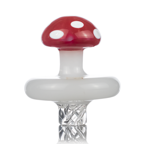 The MJ Arsenal Carb Cap features a mushroom design with a red cap and white spots, white stem, and a clear twisted glass base for directional airflow, displayed against a white background.