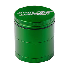 The Santa Cruz Shredder Medium 4-Piece Grinder is a green cylindrical anodized aluminum grinder with "Santa Cruz Shredder" printed in white on the top lid.