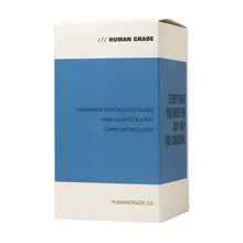 A rectangular white and blue box labeled HUMAN GRADE features the 7.5" Recycler 45 (Triple Marble) Glass Rig Water Pipe with handmade borosilicate glass, a 14mm quartz bucket, and humangrade.co at the bottom.