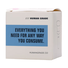 A white box with a blue label says, "EVERYTHING YOU NEED FOR ANY WAY YOU CONSUME." The top left corner shows the brand HUMAN GRADE and HUMANGRADE.CO is at the bottom. Includes the Human Grade Bulb Glass Bowl Slide 10mm/14mm.