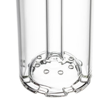 Close-up of the bottom of an MJ Arsenal Piston Gravity Bong, made of clear borosilicate glass with visible internal tubes and a disc percolator featuring circular holes at the base.