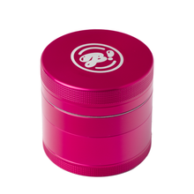 The BIGFUN! Medium Grinder is a metallic pink aluminum grinder with a textured grip and a white stylized logo on the lid. Shown against a white background, it features a built-in pollen sift for added convenience.