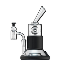 The Softglass Tandem Rig Kit is a modern tabletop vaporizer featuring borosilicate glass, metal accents, a cylindrical chamber, angled mouthpiece, and black ribbed center grip—perfectly designed for smooth vapor inhalation.