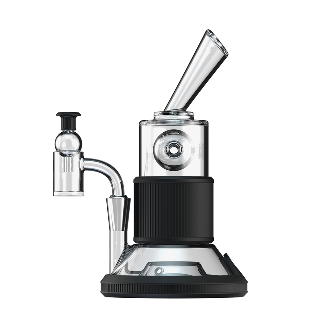 The Softglass Tandem Rig Kit is a modern tabletop vaporizer featuring borosilicate glass, metal accents, a cylindrical chamber, angled mouthpiece, and black ribbed center grip—perfectly designed for smooth vapor inhalation.