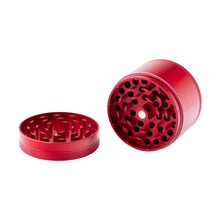 The BIGFUN! XL Grinder is a red aluminum grinder shown in two pieces, each with diamond-shaped teeth inside, designed for efficiently grinding herbs or spices.