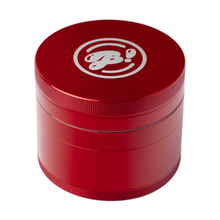 The BIGFUN! Large Grinder is a red cylindrical aluminum grinder with textured edges and a white circular logo with stylized text on the top lid, shown isolated on a white background.
