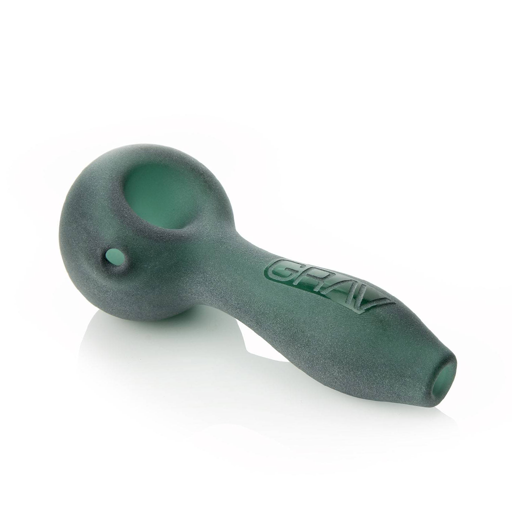 The Grav Sandblasted Spoon is a frosted green pipe with a matte finish, featuring a rounded deep bowl and GRAV embossed on the side, shown against a white background.