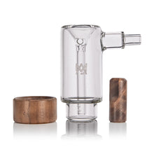 The MJ Arsenal Alpine Series - Steamboat Bubbler, made of clear borosilicate glass, stands upright with a round wooden dish and a cylindrical wooden mouthpiece, all displayed on a white background.