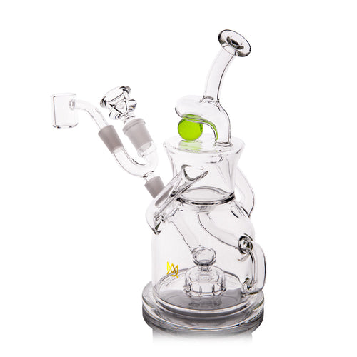 The MJ Arsenal The iLL-ien Dab Rig is a clear glass rig with multi-chamber design, bent mouthpiece, flat base, side arm for accessories, intricate tubing, and features green marble accents plus a spinning marble top.