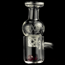 The MJ Arsenal Ruby Terp Pearls (6mm) features two small ruby pearls swirling rapidly inside a clear glass container, showcased against a black background.