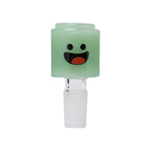 The Human Grade Novelty Bowl is a small, light green cylindrical glass bowl with a wide, happy cartoon face and clear base—perfect as a fun accessory for any 14mm water pipe. Available individually or in packs of 3.