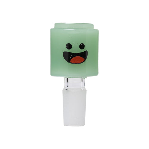 The Human Grade Novelty Bowl is a small, light green cylindrical glass bowl with a wide, happy cartoon face and clear base—perfect as a fun accessory for any 14mm water pipe. Available individually or in packs of 3.