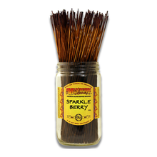 A glass jar labeled Wild Berry Incense Sticks, filled with 11" hand-dipped incense sticks standing upright and featuring a yellow and red decorative front label.