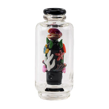 The Empire Glass Works Save the Seas Peak Top is a clear glass bottle with a black base, featuring glow-in-the-dark coral, mushrooms, and plants. It doubles as a Puffco Peak glass attachment with a round, black-rimmed opening.