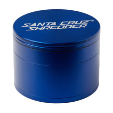 The Santa Cruz Shredder Large 4-Piece Grinder is a blue, cylindrical, medical-grade, anodized aluminum herb grinder with "Santa Cruz Shredder" printed in white on the lid.