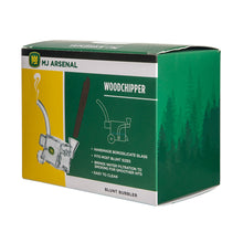 A green and yellow MJ Arsenal Woodchipper Blunt Bubbler box displays a glass blunt bubbler and wooden blunt, emphasizing water filtration, spill resistance, borosilicate glass, and easy cleaning.