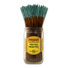 A glass jar labeled Wild Berry Incense Sticks holds a bundle of hand-dipped, 11" incense sticks with teal tips, standing upright against a white background.