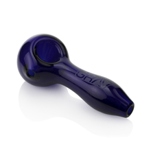 The Grav Classic Spoon Pipe is a dark blue hand pipe made from scientific glass with a round bowl, short stem, ash-catching mouthpiece, and "GRAV" etched on the side, displayed on a white background.