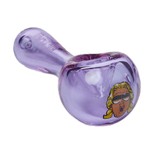 The Ric Flair Drip Spoon Pipe is a translucent purple borosilicate glass pipe with a cartoon image of a long blond-haired person in sunglasses on the bowl end.