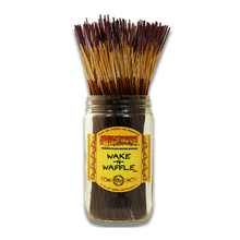 A glass jar labeled Wild Berry Incense Sticks holds many 11" hand-dipped incense sticks with lighter tips, standing upright and fanned out. The yellow label has red text and decorative touches, highlighting the brand’s craftsmanship.