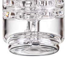 Close-up of the textured borosilicate glass on the MJ Arsenal Alpine Series - Halo Peak Top, featuring a patterned design and shimmering light effects—an ideal, stylish upgrade for your Puffco Peak.