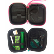 The Happy Kit OG - Pink is a compact, zippered smoking kit with compartments. Shown open, the bottom fits a glass pipe, grinder, green tube, lighter, rolling papers, and a rolled cigarette; the top features empty storage slots.